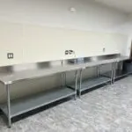 A long shot of the stainless steel Caterer Tables